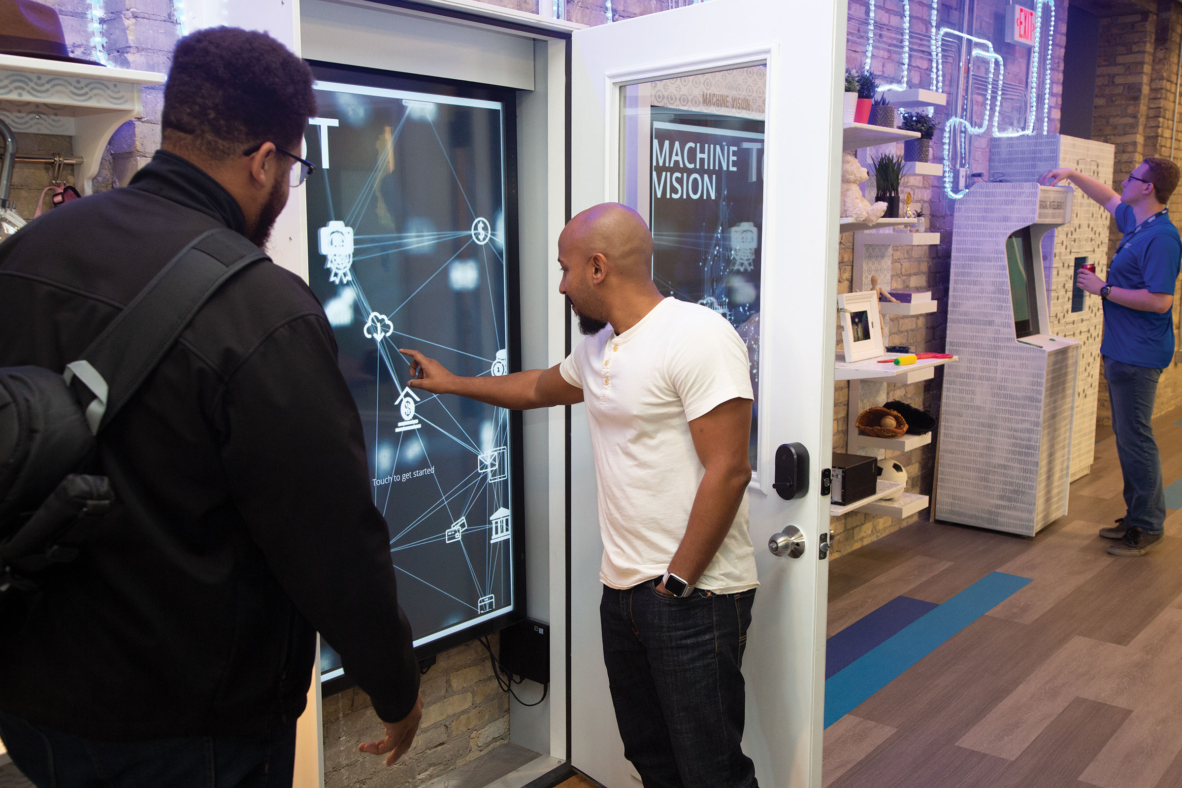 itc-tech-center-two-men-using-large-wall-touchscreen