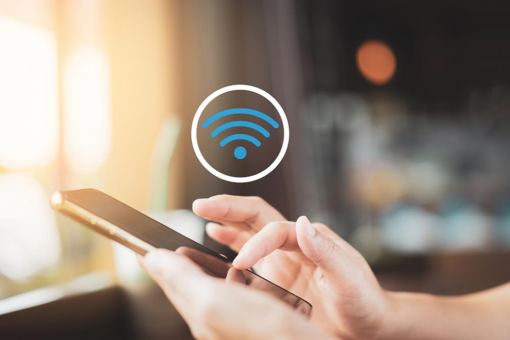 WiFi Person holds smartphone that uses WiFi