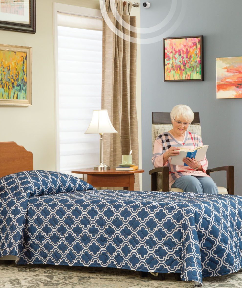 SafelyYou in the corner of a room while a senior reads.