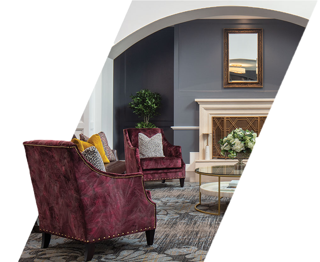 Sitting room with chairs and coffee table in front of a fireplace