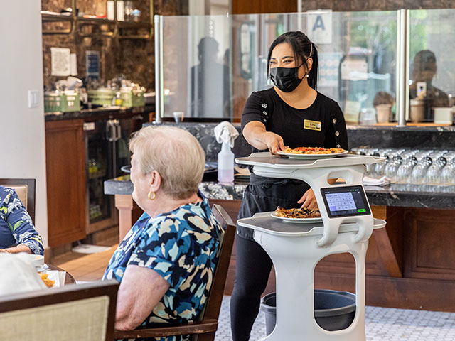 Servi food robot running food for Senior Living foodservice